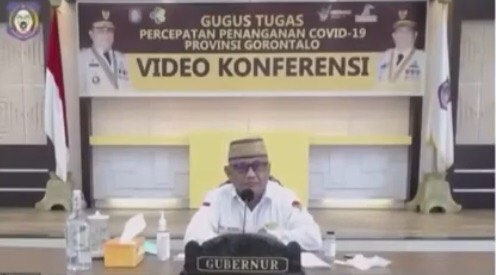 Gubernur Gorontalo, Rusli Habibi saat webinar dengan BNPB. (Foto: Tangkapan Layar) Gubernur Gorontalo, Rusli Habibi saat webinar dengan BNPB. (Foto: Tangkapan Layar)